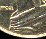 Col à 4 plis sur les pièces 10 et 50 centimes Marianne
