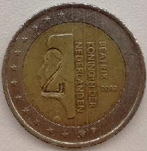 pièce 2 euros 2002  pays-bas avec une surfrappe contre-marque